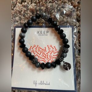 Keep Collective, black/silver stretch bracelet. New in package. Never worn.